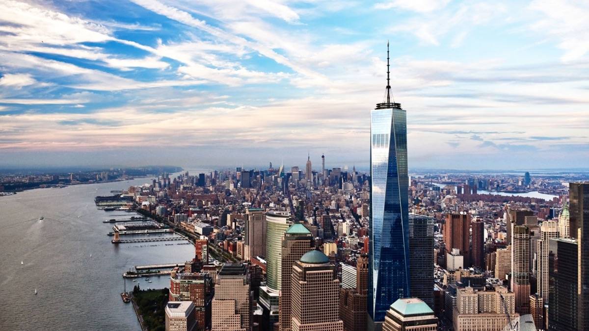 Wide shot of One World Observatory with Manhattan spreading out in the background